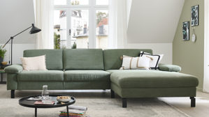 Ecksofa SOFAkultur aus Stoff in Grün SOFAkultur Programm SK 239 - Ecksofa mit Federkern olivgrüner Feincord & schwarze Metallfüße 192 - Stellfläche ca. 292 x 185 cm