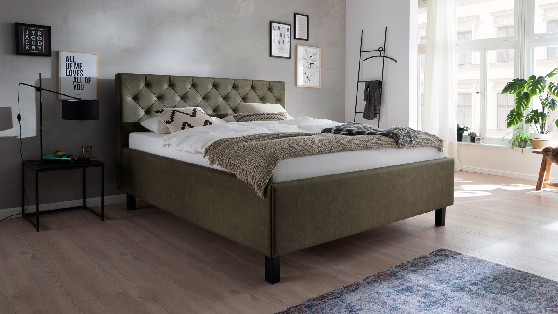 Polsterbett Meise.möbel aus Stoff in Grün Polsterbett San Remo mit Bettkasten grüner Bezug Bulus 17 & schwarze Holzfüße - Liegefläche ca. 180 x 200 cm