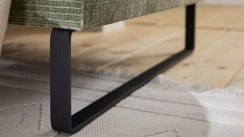 Polsterhocker Roomio® aus Stoff in Grün Roomio® No. 4105 - XXL-Polsterhocker schildkrötenfarbener Bezug Monty & schwarze Kufenfüße 256 MK - ca. 100 x 70 cm